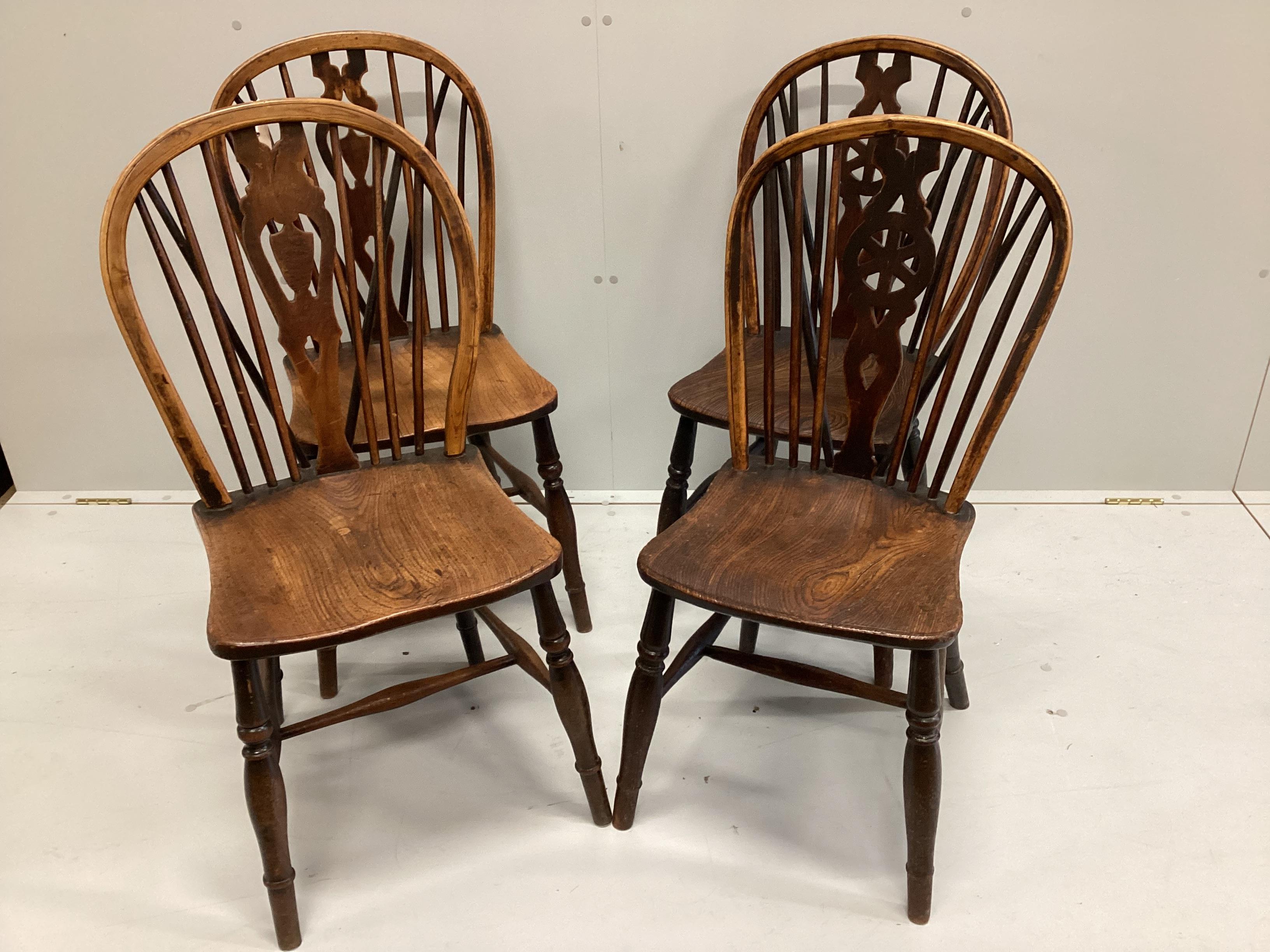 A harlequin set of four 19th century ash, elm and beech Windsor chairs